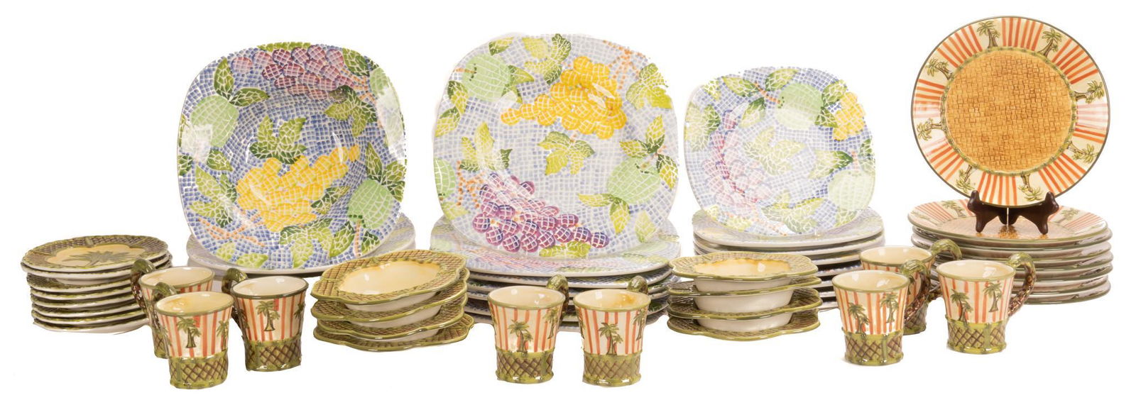 Pair of Hand-Painted Ceramic Dinnerware Sets: Pair of hand-painted ceramic dinnerware set, one manufactured by Centrum, part of the Caravan collection, designed by Nanette Vacher, featuring palm tree motif, to inclued cups, bowls, plates, total o