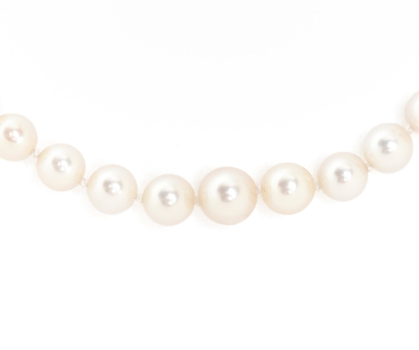 Vintage Graduated Oriental Pearl Necklace: Graduated cultured pearls (3.5-6.5mm) hand knotted between and finished with sterling silver clasp. Length 21" Provenance: A San Antonio, Texas collection We happily provide seamless shipping serv