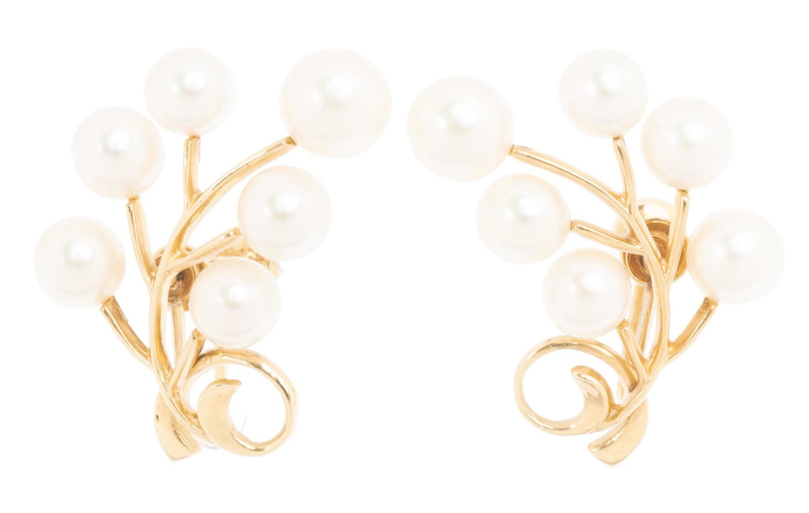 Vintage Mikimoto Pearl 14k Gold Earrings: Vintage Mikimoto graduated pearls (6.5-7mm) ear climber earrings of 14k yellow gold with screw back sets; includes presentation box. Length 1"; total weight 6.7 grams Provenance: The Estate of Bri