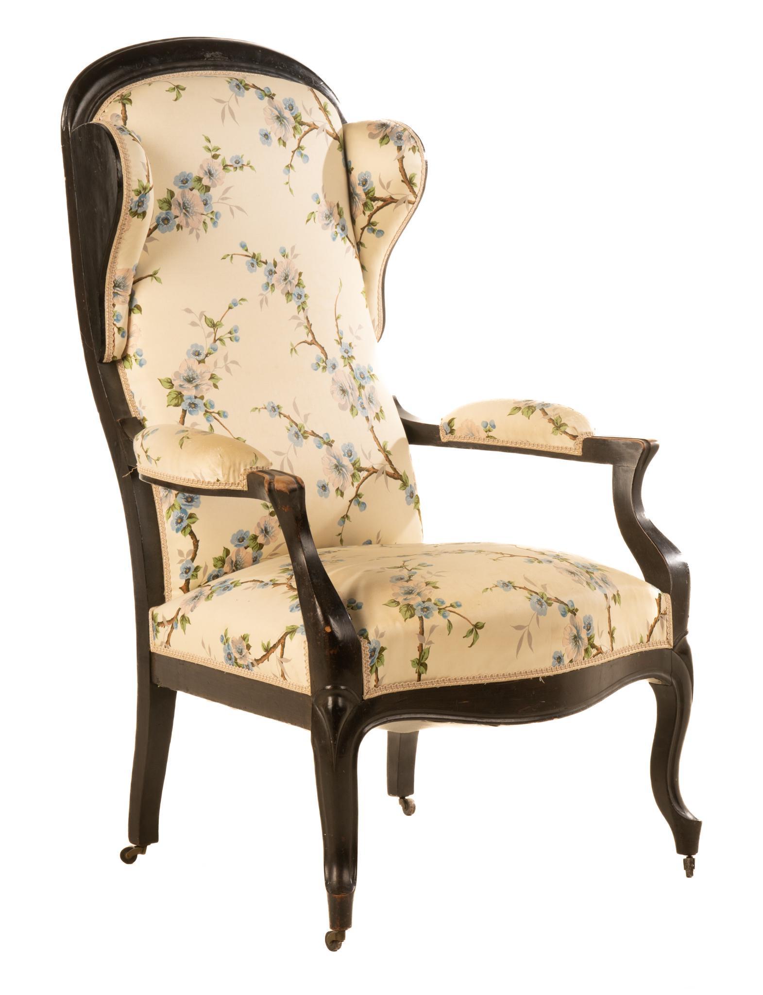 Upholstered Louis Philippe Style Armchair: Louis Philippe style armchair, having carved wooden frame and upholstered back and seat, featuring floral motif 46"h x 27.5"w x 22"d We happily provide seamless shipping services on everyt