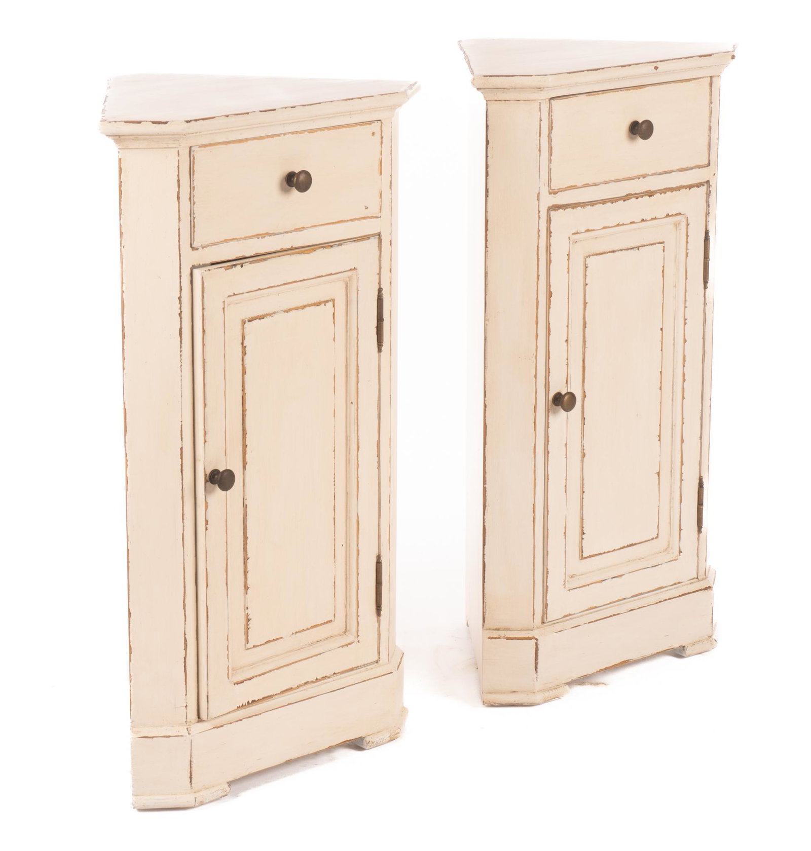 Pair of Louis Philippe Nightstands: Matched pair of painted Louis Philippe period nightstands of triangular form, having single drawer above single door that opens to shelved interior, circa 1860 30"h x 18"w x 12"d We happil