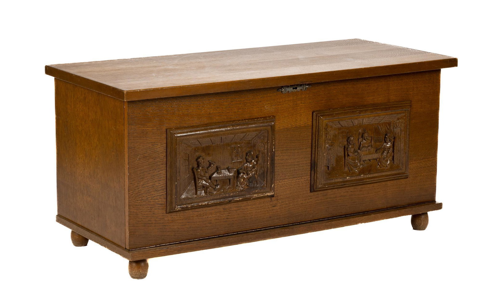 European Blanket Chest: European blanket chest, featuring carved reliefs, depicting figures in historical dress, having hinge top, opening to interior lined storage, supported on bun feet, to include key 20"h x 41"w 
