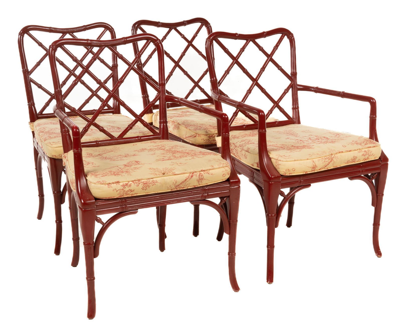 Set of (4) Chinese Chippendale-Style Armchairs: Matched set of four Chinese Chippendale-style armchairs, manufactured by William Sonoma, faux bamboo and cane, having cushioned seats, and bowed legs 35"h x 21"w x 20"d Provenance: A San