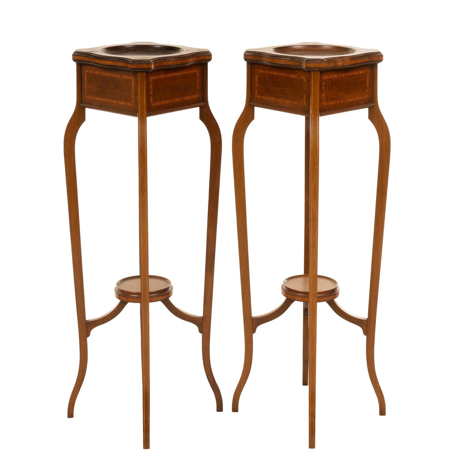 Pair of Sheraton Style Ashtrays: Matched pair Sheraton-style floor standing ashtrays, having bowed legs that meet at a lower shelf and marquetry detailing with throughout 41.5"h x 12"w x 12"d Provenance: An Alamo Heights,