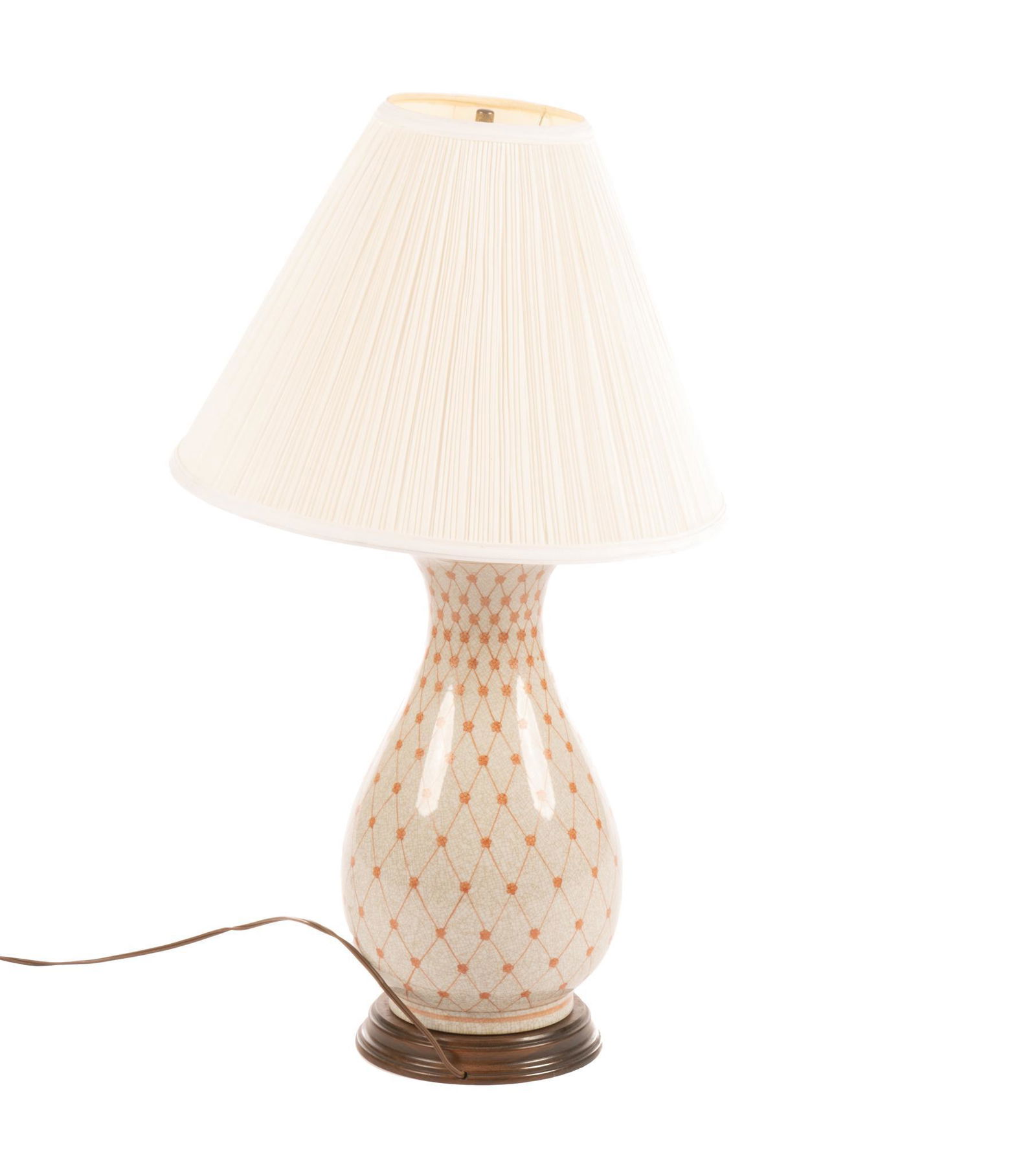 Vintage Table Lamp: Vintage table lamp, featuring ceramic base, with red patterned diamond and flower design, supported on wooden pedestal, to include wiring, lampshade 24"h x 14"w x 19"d Provenance: The Es