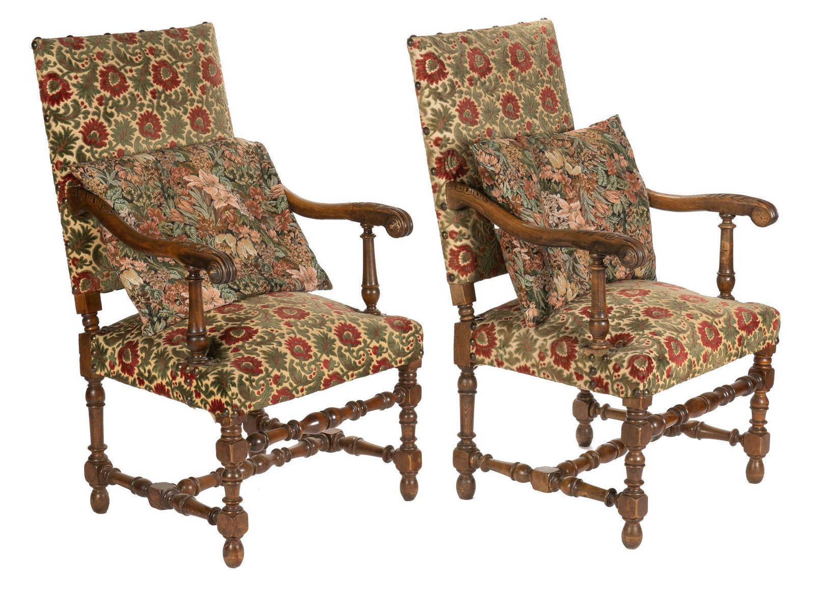 Pair of Louis XV Style Armchairs: Matching pair of Louis XV style walnut chairs, with red and green floral motif upholstery on seat and back, scrolled and turned arms with floral motif carvings, supported by turned stretchered legs, t