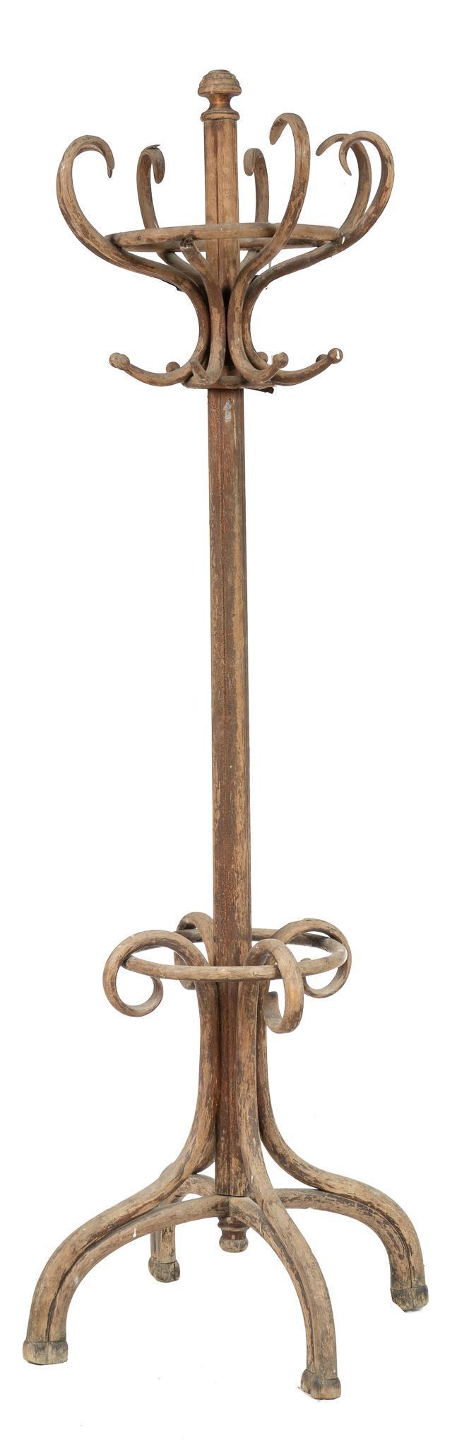 Coat Rack: Beech coat rack, with circularly arranged coat and hat hooks on top and umbrella rail at the bottom, supported on four arched legs 80h x 28w x 28d We happily provide seamless shipping services on ev