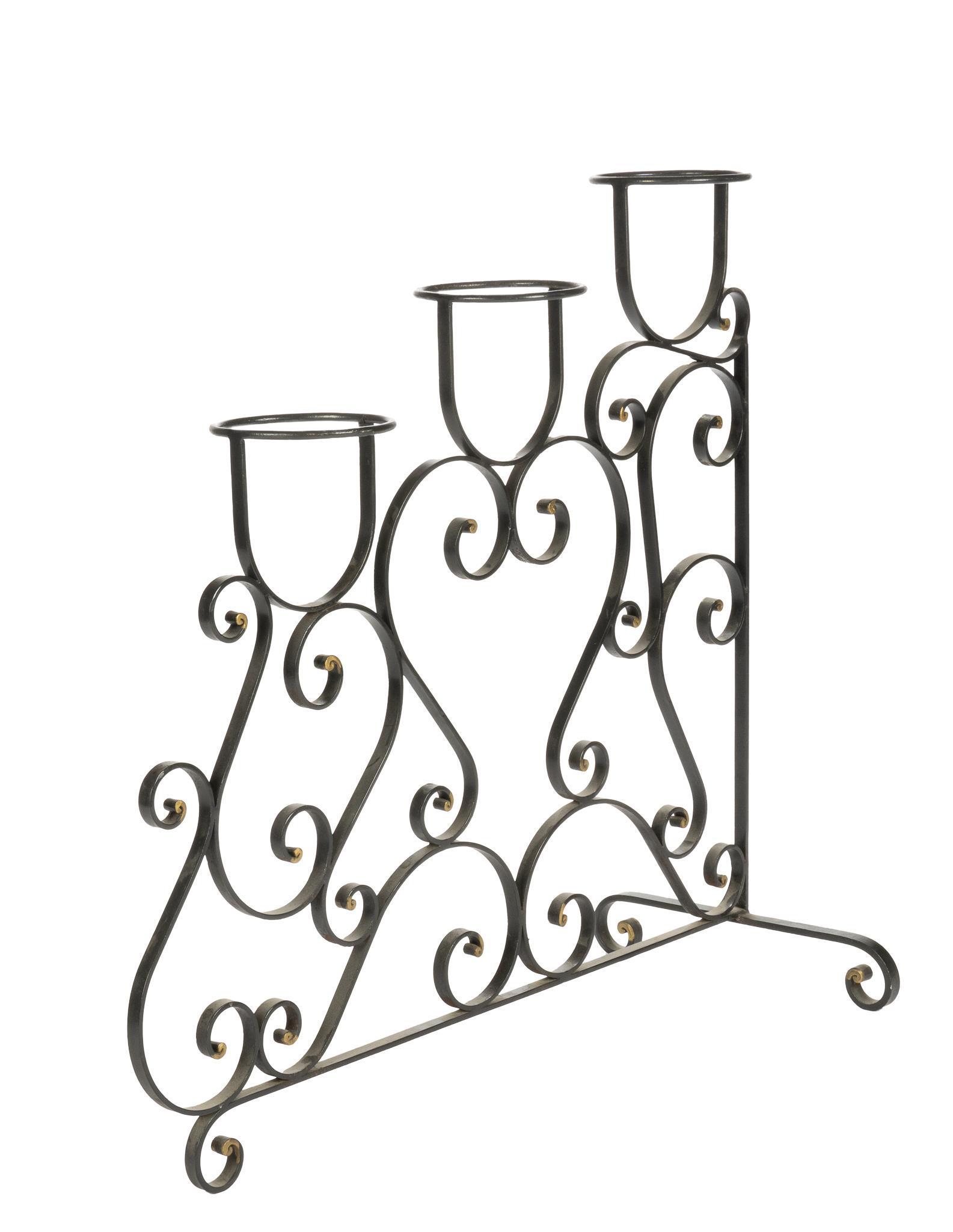Wrought Iron Plant Stand: Freestanding plant stand consisting of wrought iron scrollwork motif with three cup shaped holders, rising on scrolled feet 33.5h x 34.5w x 15.5d We happily provide seamless shipping services on eve