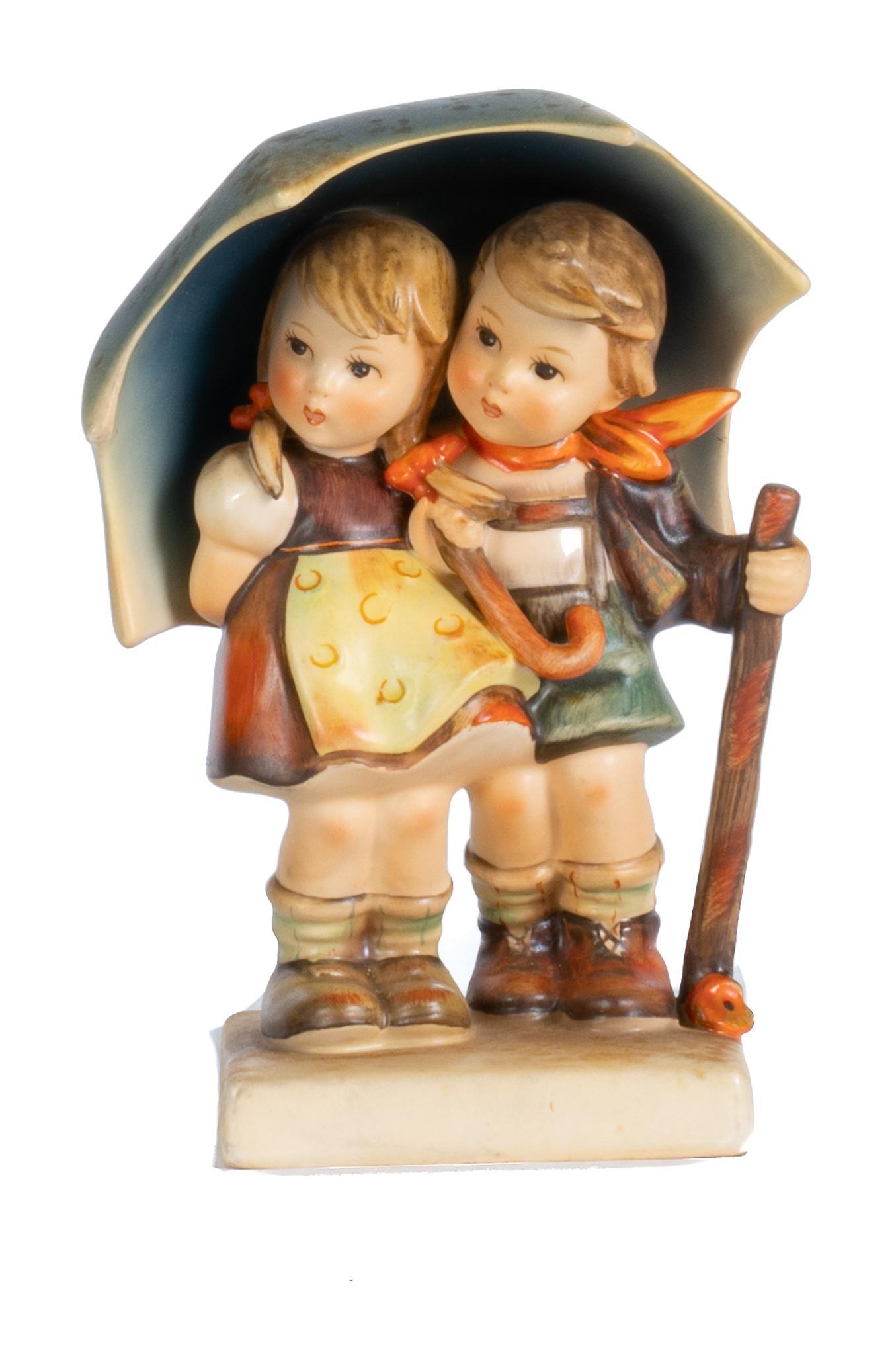 Goebel Hummel Porcelain Figurine, "Stormy Weather": Goebel Hummel porcelain figurine, Stormy Weather, marked by manufacturer, West Germany 6h x 4.5w x 3d Provenance: A San Antonio, Texas collection We happily provide seamless shipping services on ev