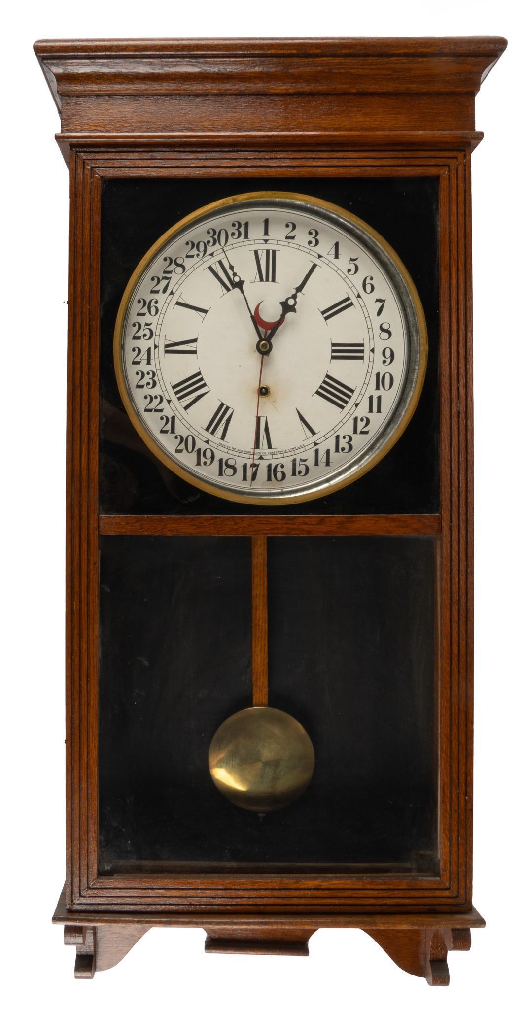 Sessions Clock Co. Regulator Wall Clock: Sessions Clock Co. (Connecticut, USA) regulator wall clock, 8 day time and calendar, lightly carved case, glass inset door opens to pendulum and clock face marked "Made by the Sessions Clock Co.,