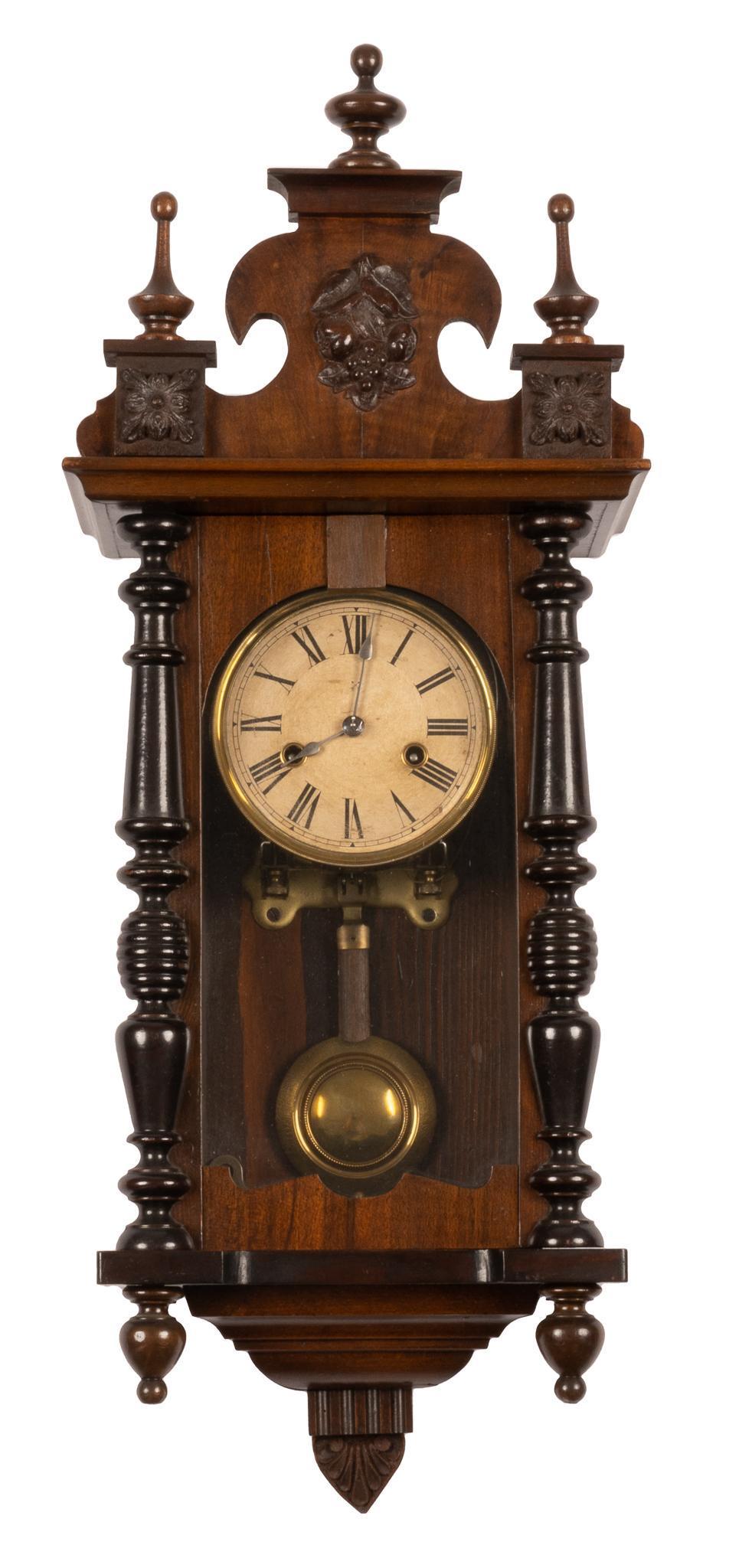 Hamburg American Clock Co. Wall Clock: Hamburg American Clock Co. (Germany) wall clock, 8 day time and strike, ornately carved case including architectural details and botanical motifs, glass inset door opens to inside mechanisms and clock