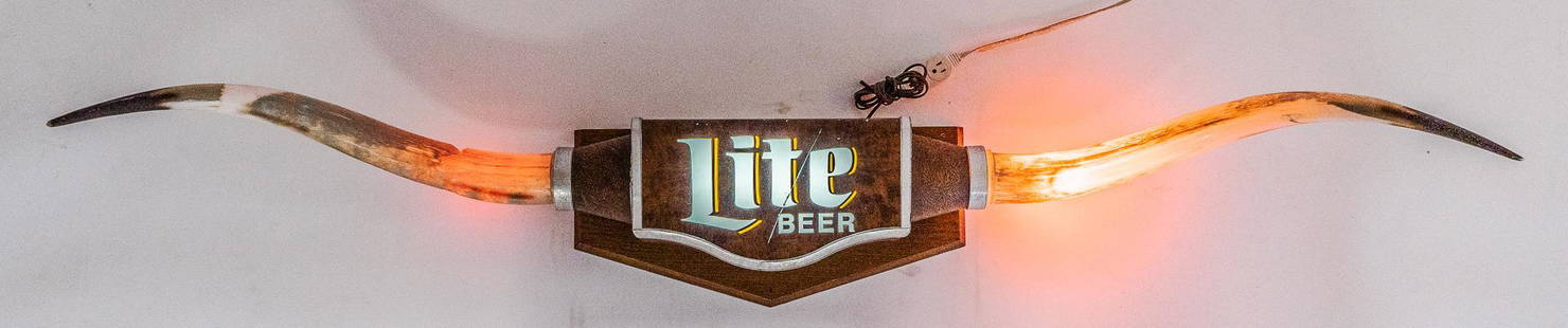 Miller Lite Beer Longhorn Light Up Advertising Sign: Miller Lite Beer light up advertising sign, featuring light up longhorns, mounted to light up steel box marked "Lite / Beer, back marked "APR 11 1991", "57-14245 Beer Brewed by Miller Brewing Co., Mil