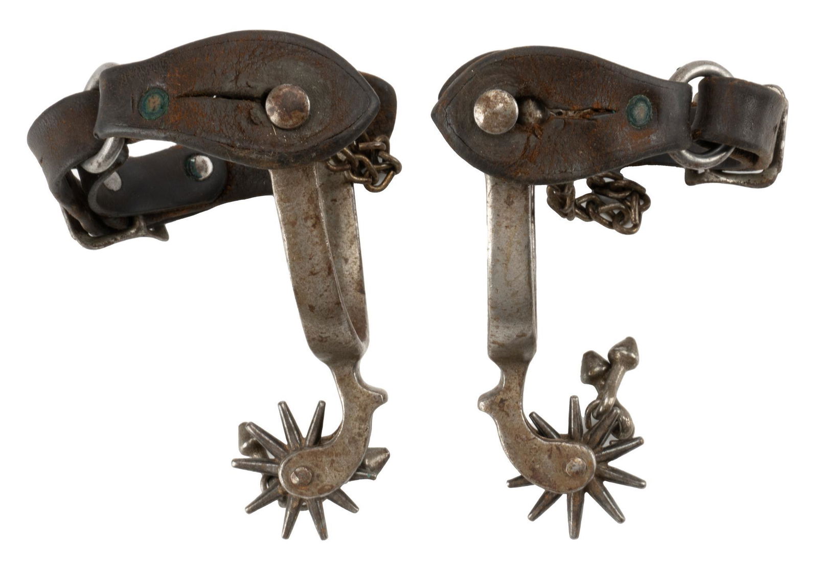 Early Cowboy Spurs: Early cowboy spurs with jingle bobs, heel chains, 10 point rowels, attributed to August Buermann height 0.5 in. x width 3 in. x depth 7.5 in. Provenance: An Alamo Heights, Texas collection We happi