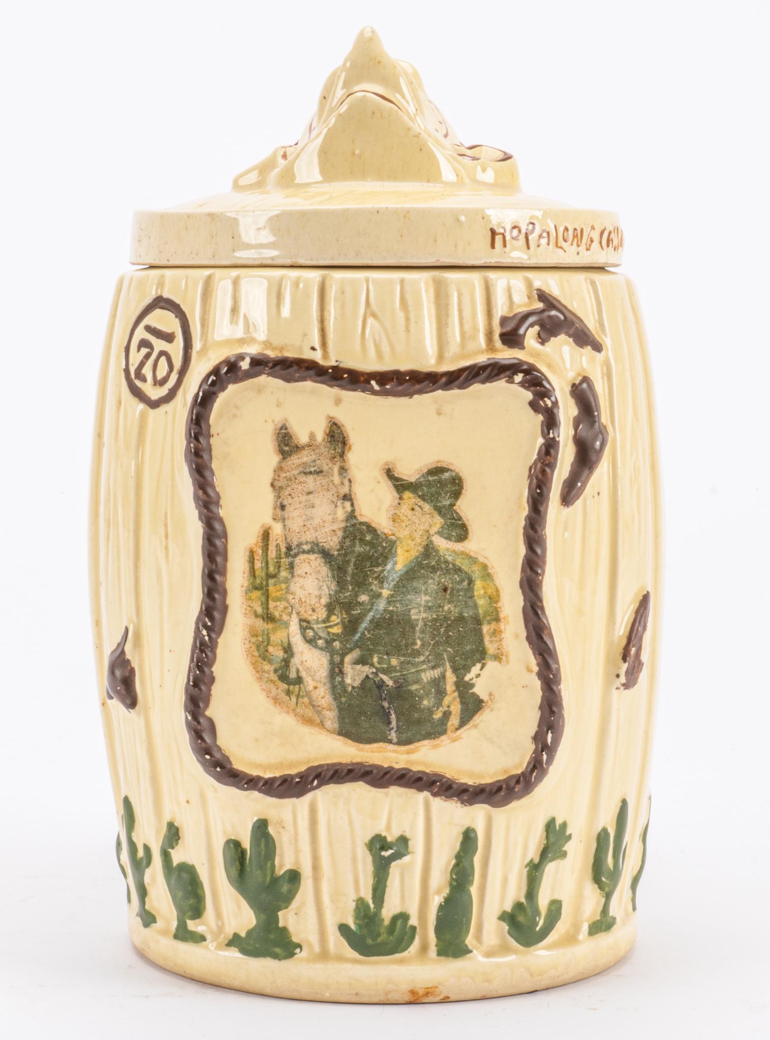 Hopalong Cassidy Cookie Barrel: Ceramic Hopalong Cassidy (the fictional cowboy hero created in 1904 by the author Clarence E. Mulford) cookie barrel, featuring faux painted design, marked "Hopalong Cassidy cookie barrell), with