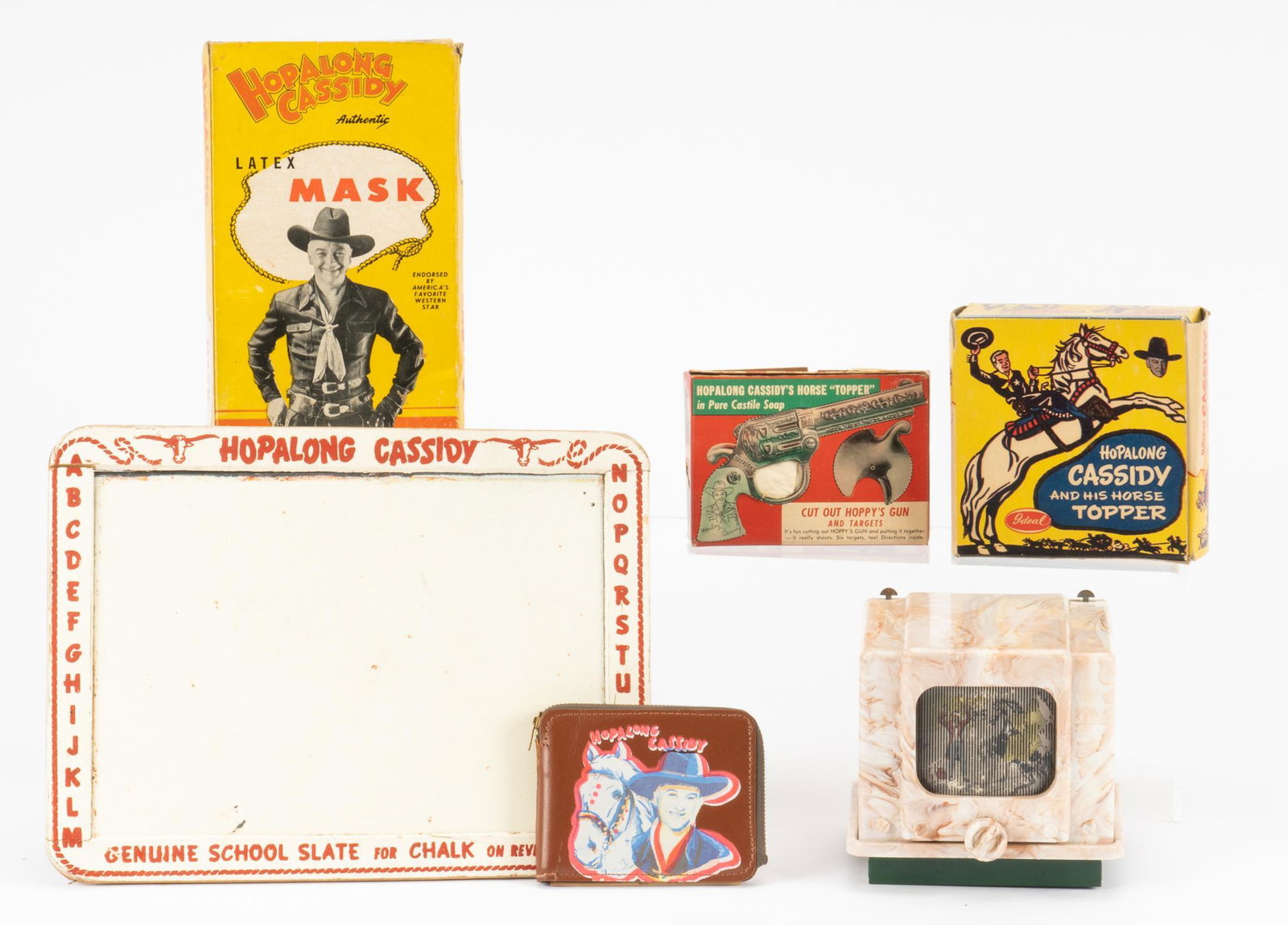 (6) Hopalong Cassidy Collectibles: Collection of six (6) Hopalong Cassidy (the fictional cowboy hero created in 1904 by the author Clarence E. Mulford) collectibles to include school slate, latex mask, cut-out toy gun, sterescope, hopa