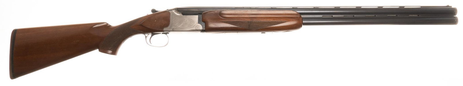 Winchester Model 101 XTR LW 12-Gauge O/U Shotgun: Serial: K497167E Manufacturer: Winchester, Winchoke TM/ Japan Model: 101 XTR Lightweight Caliber: 12 Ga. (3" chambers) Barrel length: 27" OAL: 43" Condition: Good; wood stock has fair amou