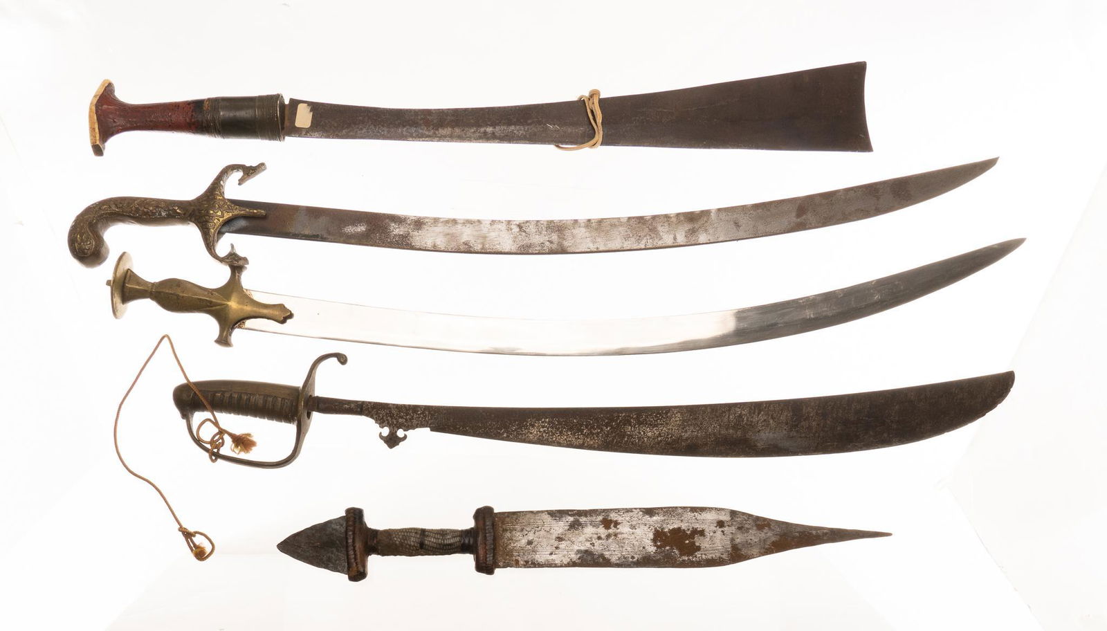 Collection of 5 African & Asian Style Blades: Includes: Afghan style saber w/ scabbard; Indian Moughal saber w/ scabbard; Indonesian style short sword w/ scabbard; African Congo Konda machete; African Tubu dagger w/ sheath Blade Length: longest,