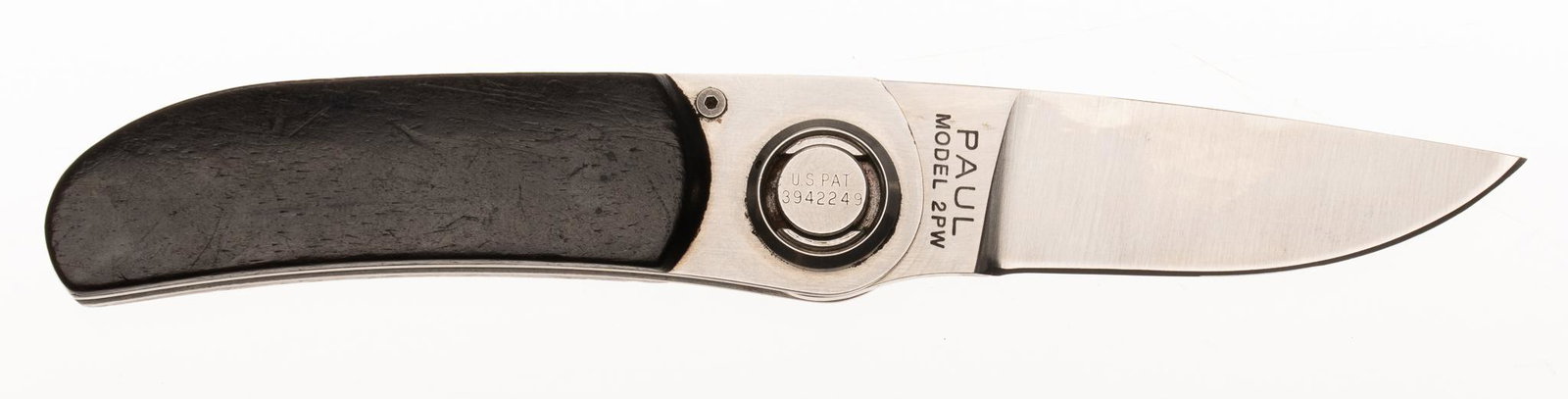 Gerber Paul Model 2PW Folding Knife: Includes: leather Gerber sheath Blade Length: 2.25" long Overall Length: 6" long Condition: Good; grips have light handling marks; light wear throughout blade Provenance: A Dallas, Texas Estat