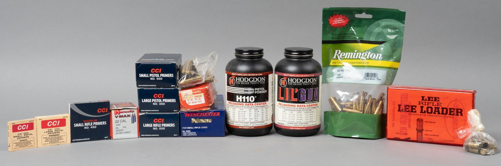 Lot of Mixed Primers, Powder & Cases With Reloader: Includes: -Hogdon H110 Pistol Powder, 1lb. sealed -Hogdon Lil'Gun Shotgun Powder, 1lb. sealed -1000 Winchester smal rifle primers -100 CCI small rifle primers -1000 CCI large rifle primers -1060 CCI s