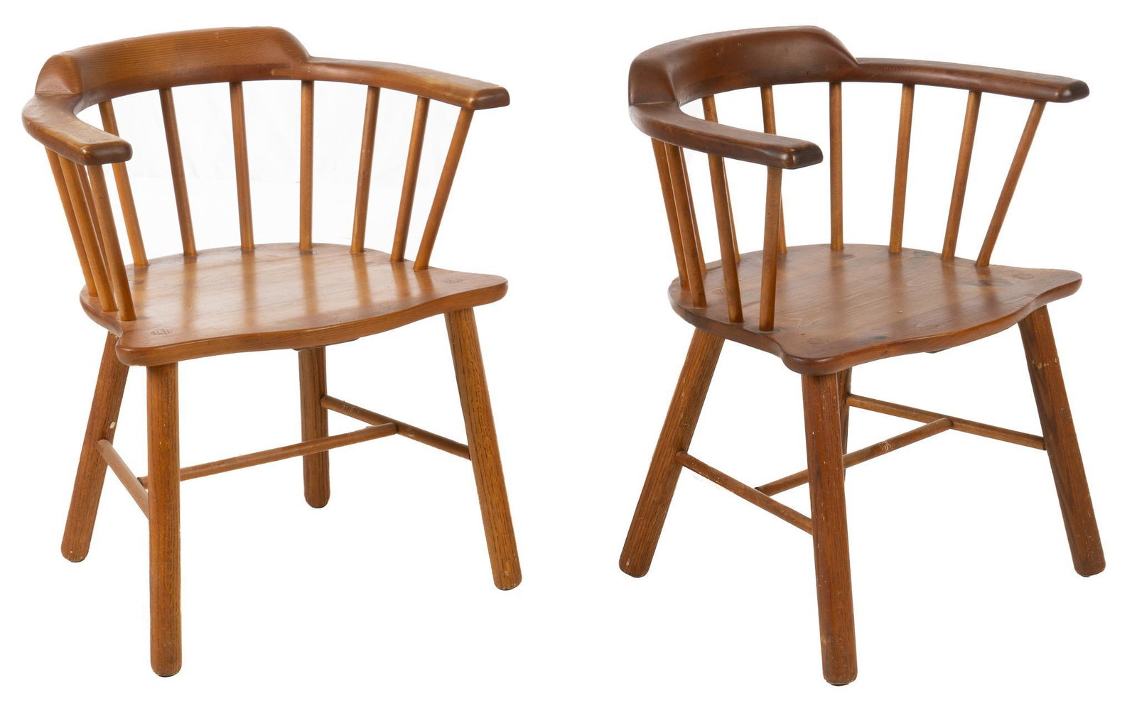 Pair of Roy A. Behrens Chairs: Pair of Roy A. Behrens (San Antonio, Texas) captain's chairs, with round backs, supported on stretchered spoke legs, marked on bottom "Roy A. Behrens / San Antonio, Texas" height 28 in. x 