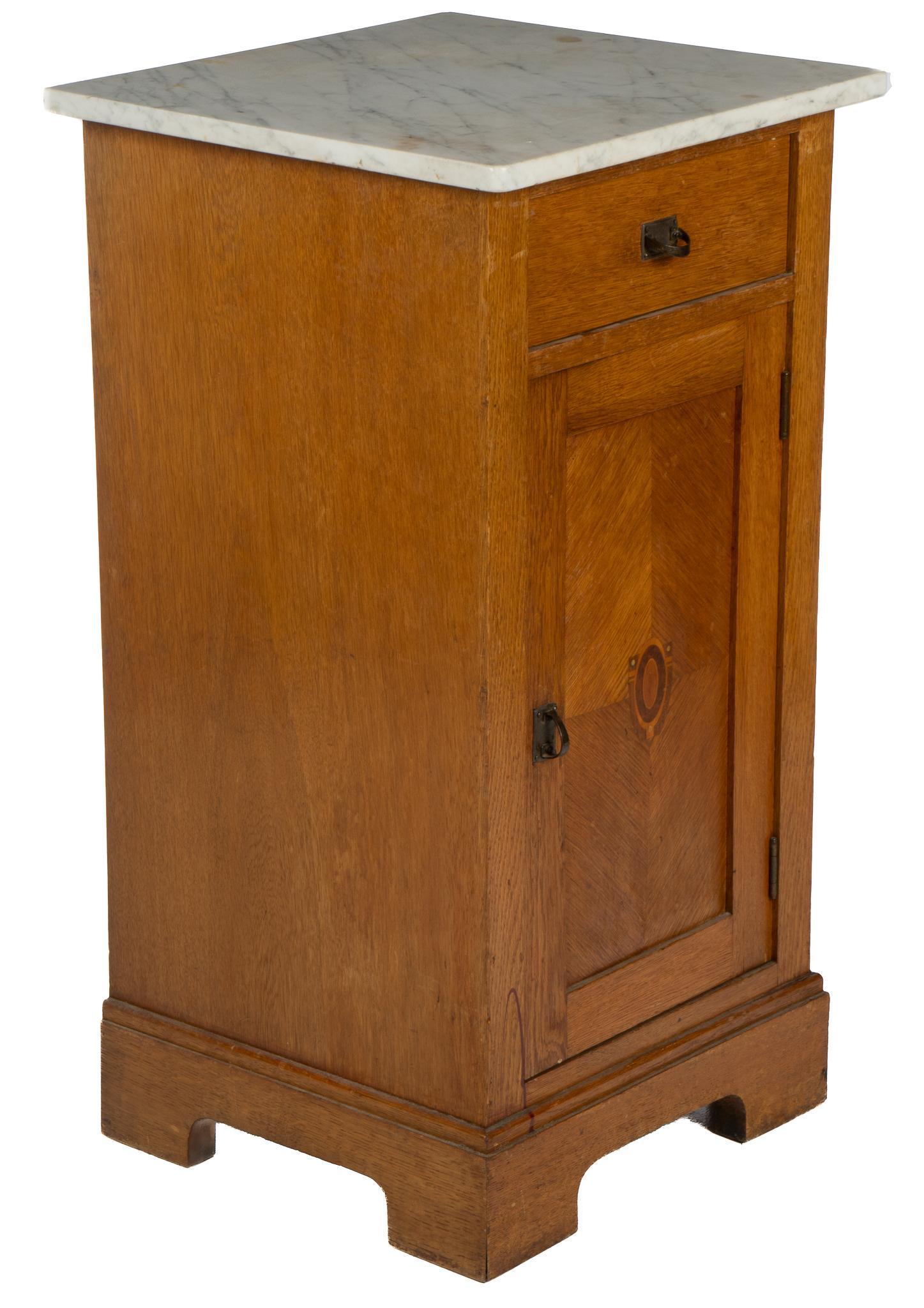 Louis Philippe Marble Top Confiturier: Louis Philippe mable top confiturier, with white marble top, over dovetailed drawer, cabinet door, featuring parquetry inlay, opening to a single shelf interior, supported on bracket feet height 31 in