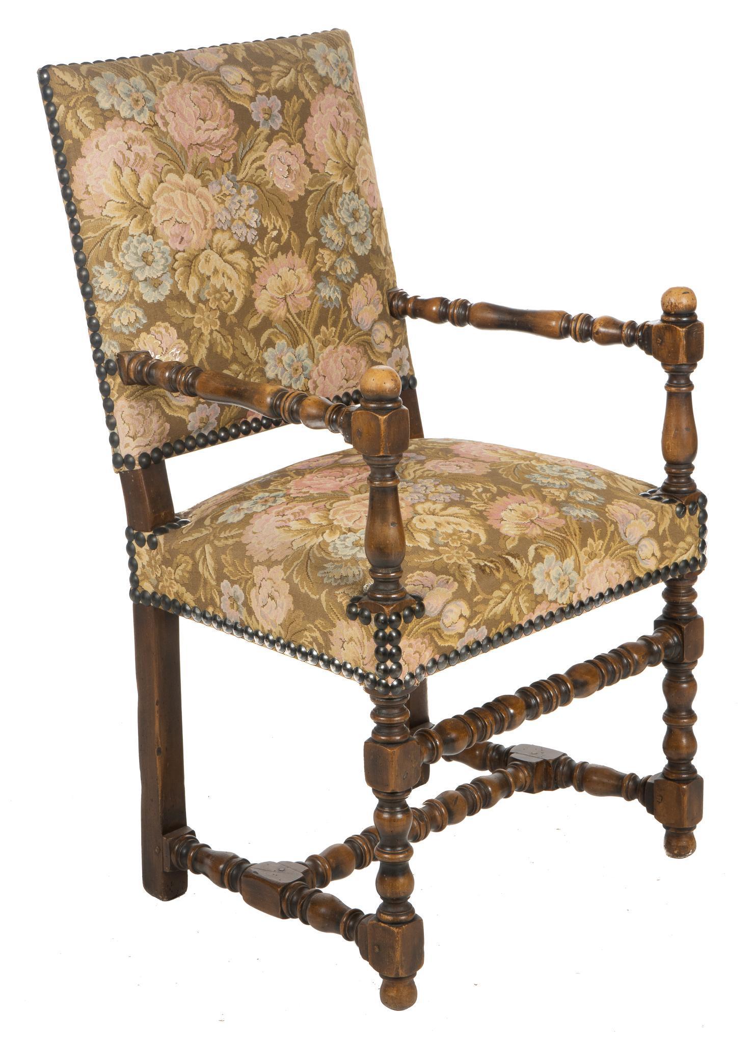 Louis XV Style Armchair: Louis XV style arm chair, with floral upholstery, metal stud trim, supported on turned stretchered legs height 37 in. x width 19.5 in. x depth 22 in. We happily provide seamless shipping services on e
