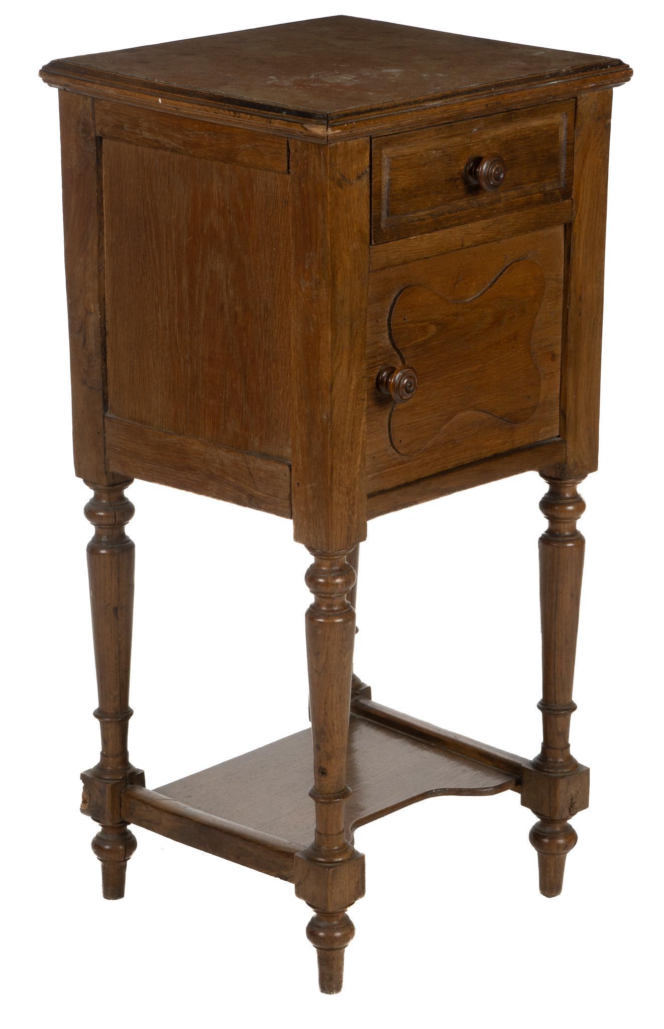 Marble Top Nightstand: Art Nouveau style nightstand, with marble inlay top, over drawer, carved cabinet door, opening to interior storage, supported on turned balustrade legs, stretchered by storage tier height 32 in. x wid