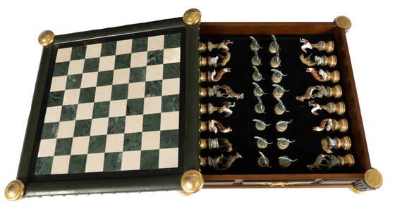 The Franklin Mint Sportsman Trophy Chess Set: The Sportsman Trophy chess set designed by Rick Fields and from the Franklin Mint, hardwood case with a marble chess board surfaced lid, lifts up to reveal wildlife themed chess pieces stored inside i