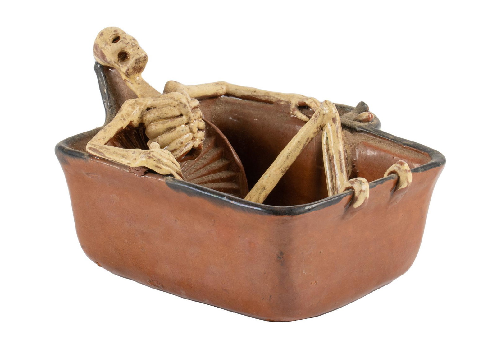 Mexican Folk Art Skeleton Sculpture: Mexican folk art skeleton sculpture, depicting a skeleton reclining in a tub height 5 in. x width 6 in. x depth 7 in. Provenance: Estate of Gordon "Fred" Plank, Terrell Hills, Texas We happily