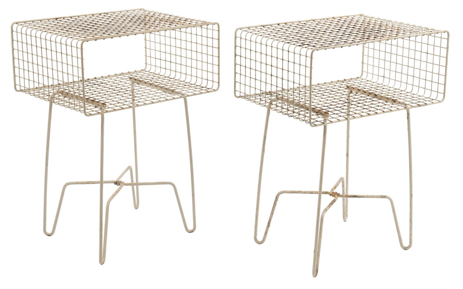 Pair of Mdesign Wire Frame End Tables: Pair of near matching wire frame end tables, manufactured by Mdesign, with rectangular frames, featuring open storage niche, supported on bent metal legs height 23 in. x width 17 in. x depth 12.5 in. 