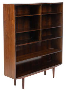 Omann Jun Mid-Century Bookcase: Danish Mid-Century rosewood bookcase, model no. 5, by Gunni Omann for Omann Jun, with top section divided into right and left, each side having two shelves, underneath is a single shelf, supported on