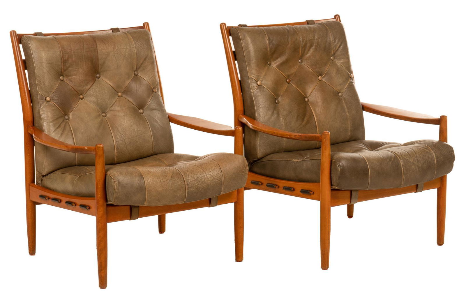 Pair of Danish Mid-Century Armchairs: Pair of Danish Mid-Century armchairs, in the style of Ingemar Thillmark, with wood frame having a ladder back, removable tufted leather upholstered cushions, supported on tapered legs height 35 in. x