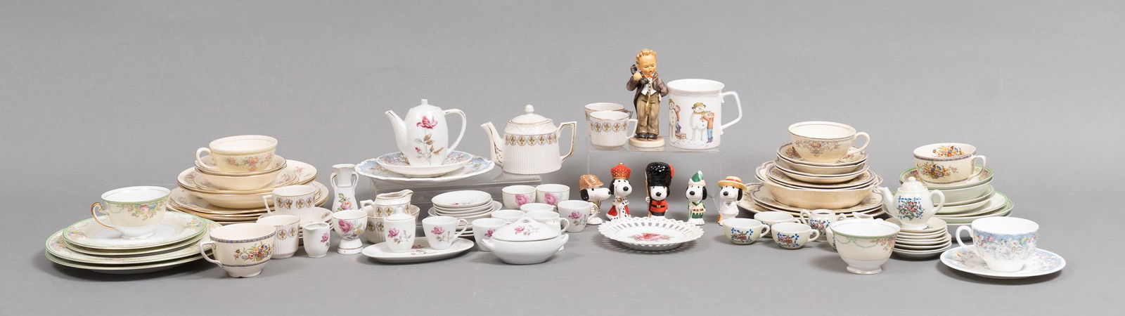 Collection of Assorted Porcelain Pieces: Collection of assorted porcelain pieces, to include three miniature tea sets, two marked "Made in Japan", one German Hummel figurine, three sets of Georgian Homer Laughlin Eggshell china tea s