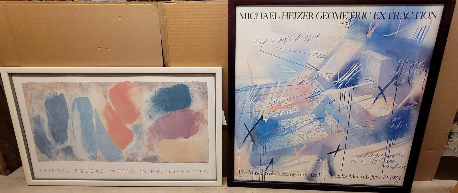 Modernist Posters (2): Collection of (2) abstract modern framed posters, to include Michael Heizer "Geometric Extraction" poster and Friedel Dzubas "Works in Progress" poster We happily provide seamless shi