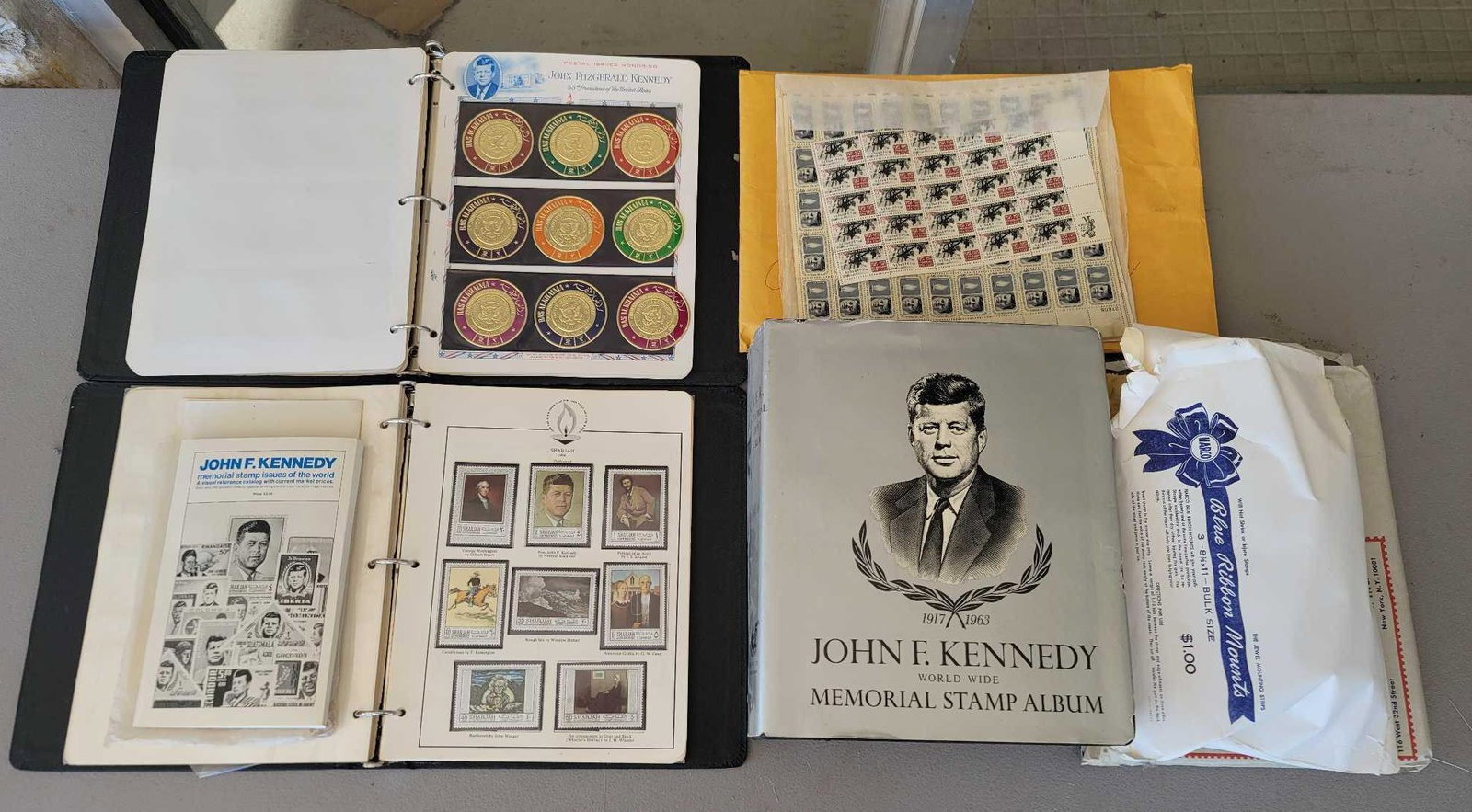 Lot of JFK Stamps and Memorabilia: Lot of JFK stamps, loose and in binders, other memorabilia height 11.5 in. x width 10 in. x depth 2 in. / binder We happily provide seamless shipping services on everything we sell. Please email us at