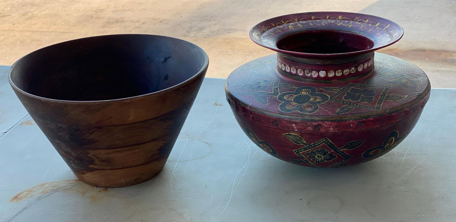 (1) Metal Vase and (1) Wooden Bowl: One painted metal vase and one wooden bowl height 7 in. x diameter 12 in. / bowl We happily provide seamless shipping services on everything we sell. Please email us at shipping@vogtauction.com or