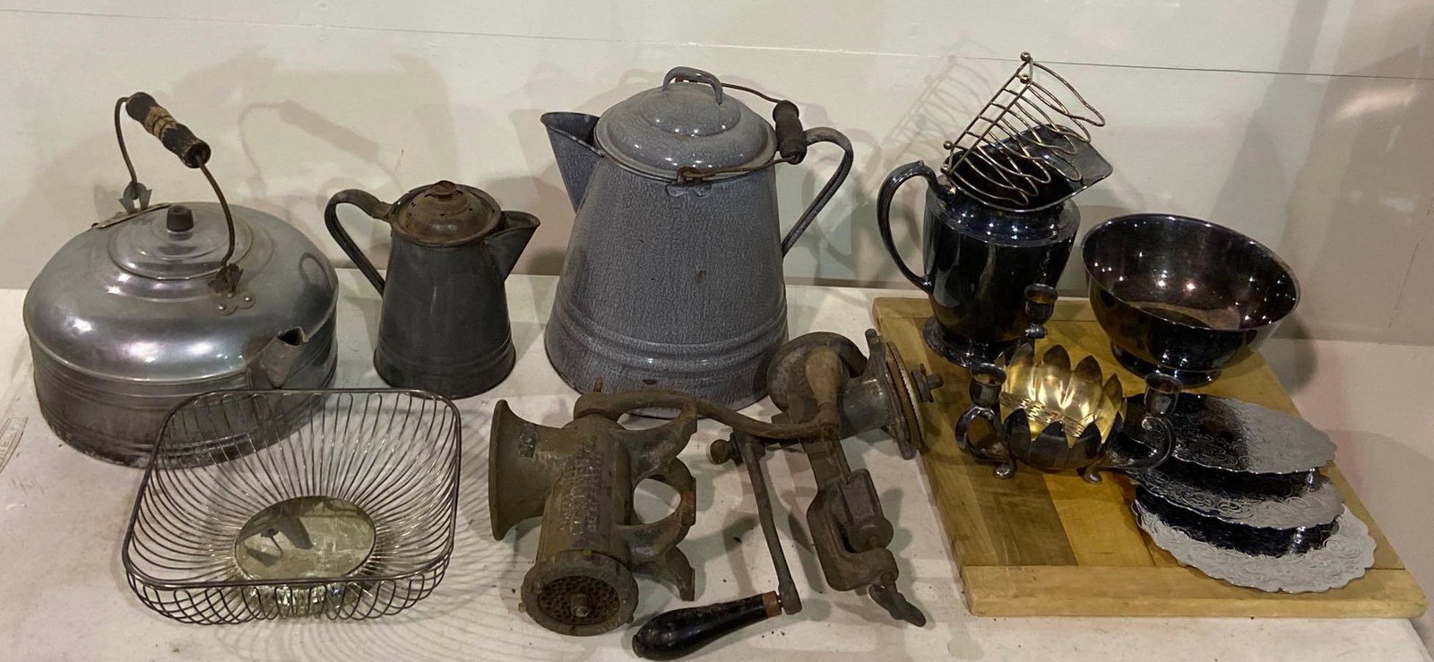 Lot of Vintage Kitchen Goods: Lot of vintage kitchen goods, to include iron mills / grinders, enameled kettles, etc. height 12 in. x diameter 10 in. We happily provide seamless shipping services on everything we sell. Please email