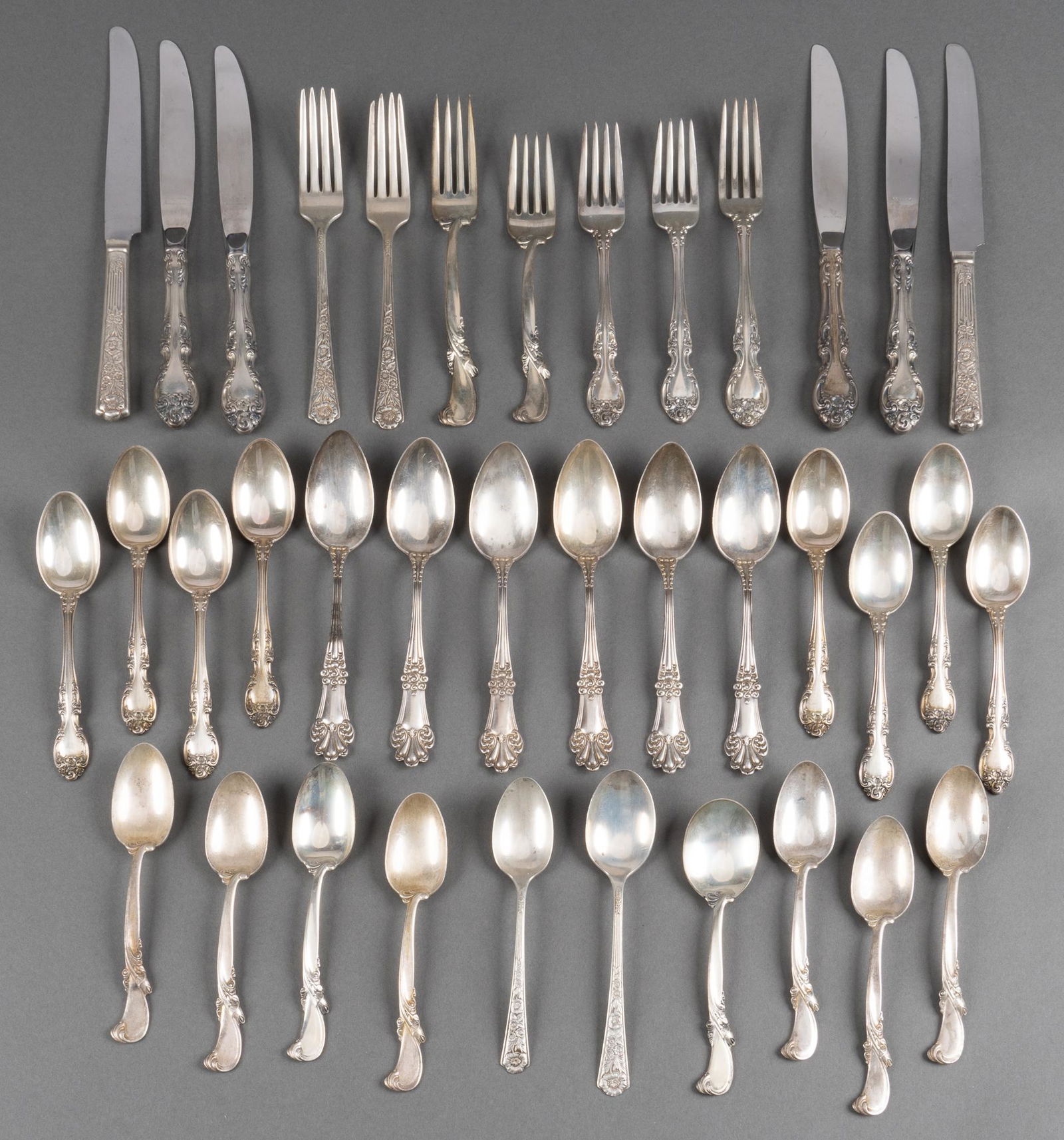Collection of Sterling Silver Flatware: Collection of sterling silver partial sets which include "Waltz of Spring" by Wallace Silversmiths, "Melrose" by Gorham, "Olympia" by Watson Newell and Century sterling. Total