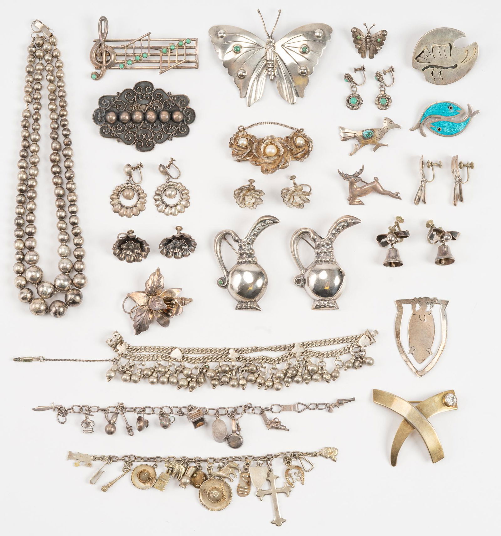 Vintage Mexican Sterling Silver Jewelry Collection: Collection of vintage sterling silver jewelry from Mexico includes bead necklace, charm bracelets, butterfly brooches, pins, earrings and pins. Necklace length 15 in., bracelets 6 in. to 7 in., butt