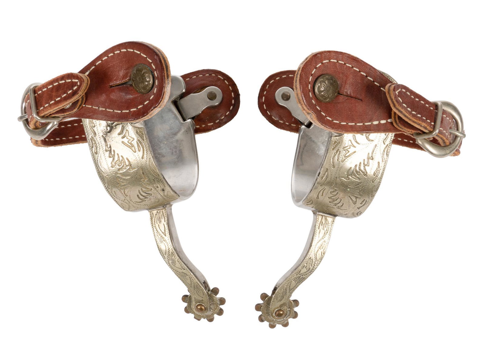 Pair of Spurs: Pair of spurs, single mounted with abstract leaf design, brown leather heel strap, floral motif swing buttons, 9 point rowels, marked "CHINA" on heel band height 1.5 in. x width 3 in. x depth 