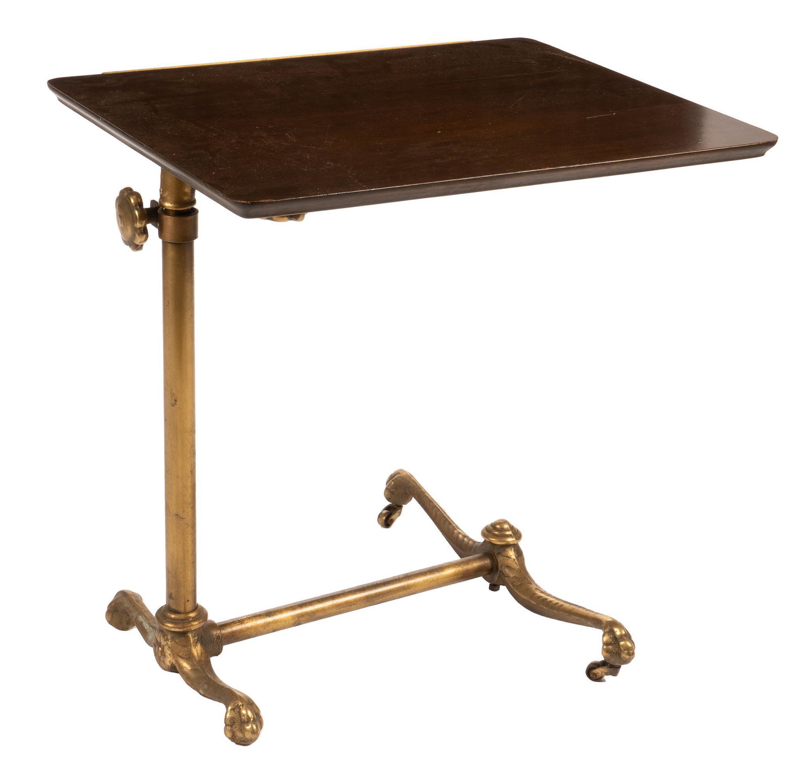 Adjustable Bedside Table: Adjustable bedside table, with wooden top, adjustable via knob, supported on brass base, ending in paw feet, supported on casters height 23 in. x width 23.5 in. x depth 18 in. We happily provide seaml