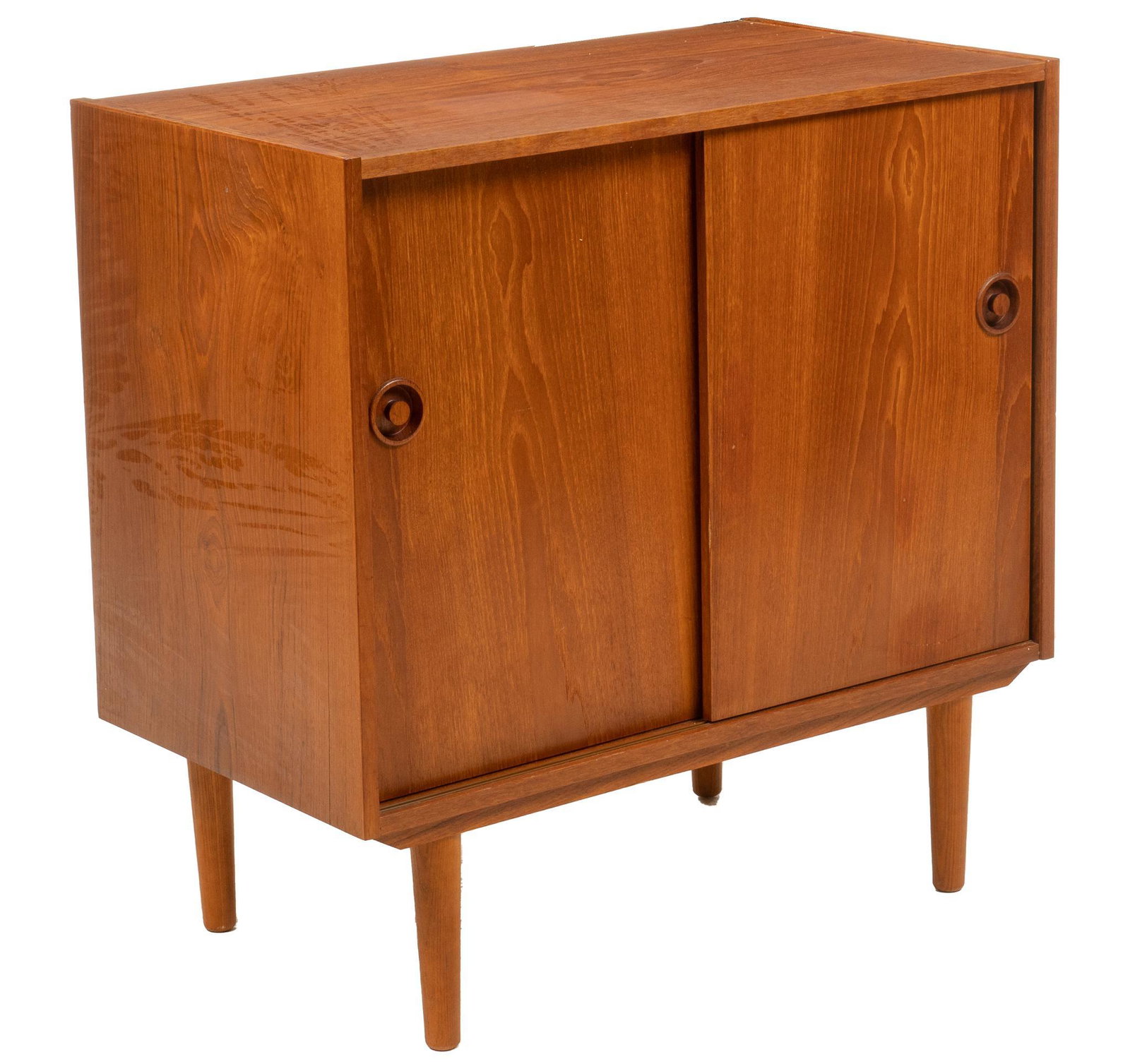 Mid-Century Cabinet: Mid-Century teak cabinet, with two sliding doors opening to interior storage, supported on tapered legs height 31.5 in. x width 31.5 in. x depth 17 in. We happily provide seamless shipping services on