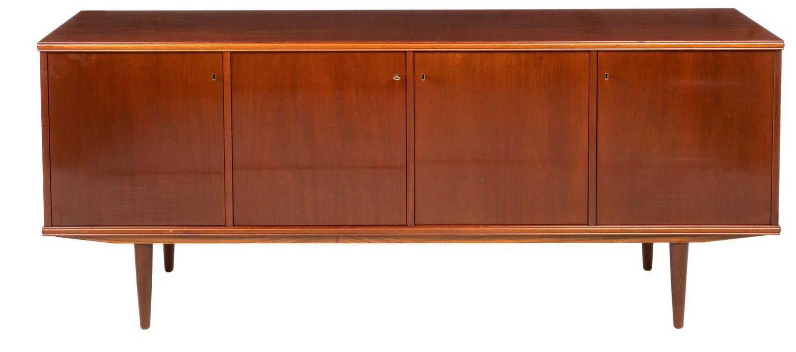 Mid-Century Credenza: Mid-Century teak credenza, four doors each opening to separate interior storage, three open to shelving and one to tray drawers, supported on pin legs, to include one key height 32 in. x width 79 in. 