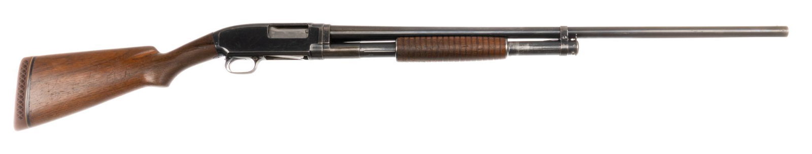 Winchester Model 12 12-Gauge Pump-Action Shotgun: Serial: 574134 Manufacturer: Winchester Repeating Arms Co. (c. 1929) Model: 12 Caliber: 12 Ga. (full choke) Barrel length: 30 in. OAL: 49.5 in. Condition: Good; wood stock has handling marks commensur