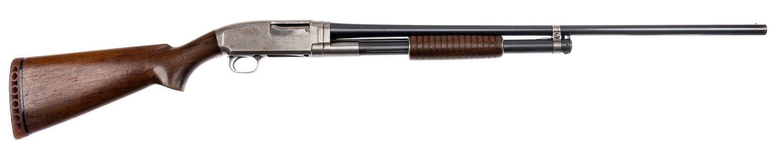 Pre-War Winchester Model 12 20-Gauge Pump-Action Shotgun: Serial: 787084 Manufacturer: Winchester Repeating Arms Co. (c. 1939) Model: 12 Caliber: 20 Ga. (full choke) Barrel length: 28 in. OAL: 46.5 in. Condition: Good; wood stock has handling marks commensur