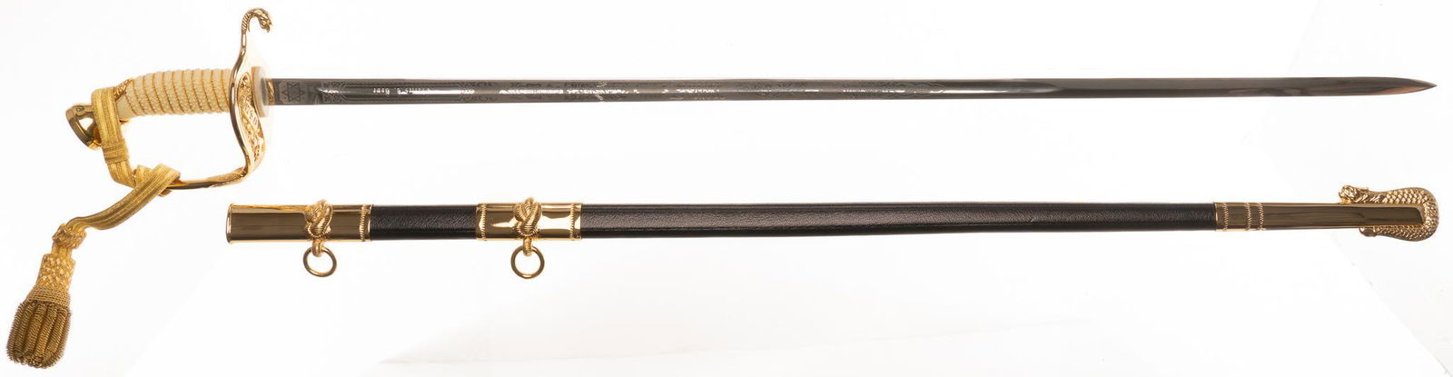 U.S. Navy H-H Model 1852 Cermonial Officer's Dress Sword W/ Leather Case & Belt: Marked: H-H (Hillborn-Hamburger Inc.); Toledo, Spain Blade Length: 29.5 in. long Overall Length: 36.5 in. long Condition: Excellent-Like New; virtually no signs of wear; light wear on carrying case In