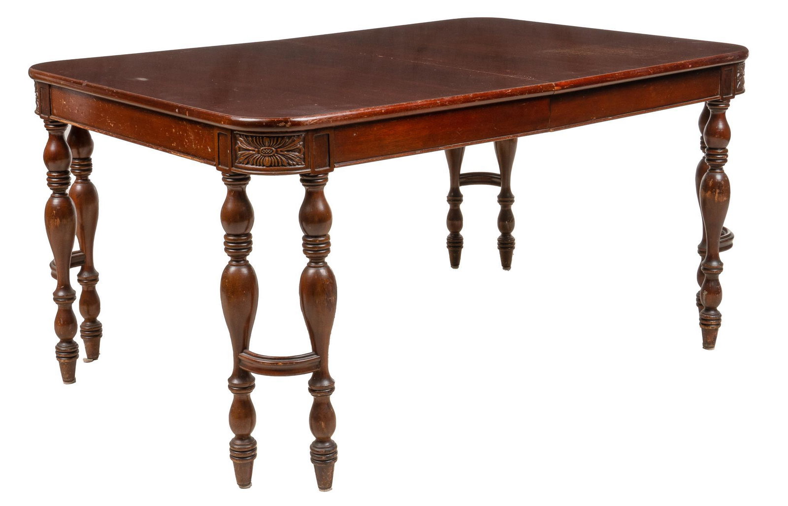 Finch Furniture Co. (USA) Extending Dining Table: Extending dining table, by Finch Furniture Company (USA), with rectangular top, with leaf insert, featuring carved floral decoration on apron, above four sets of twin balustrade legs connected with cu