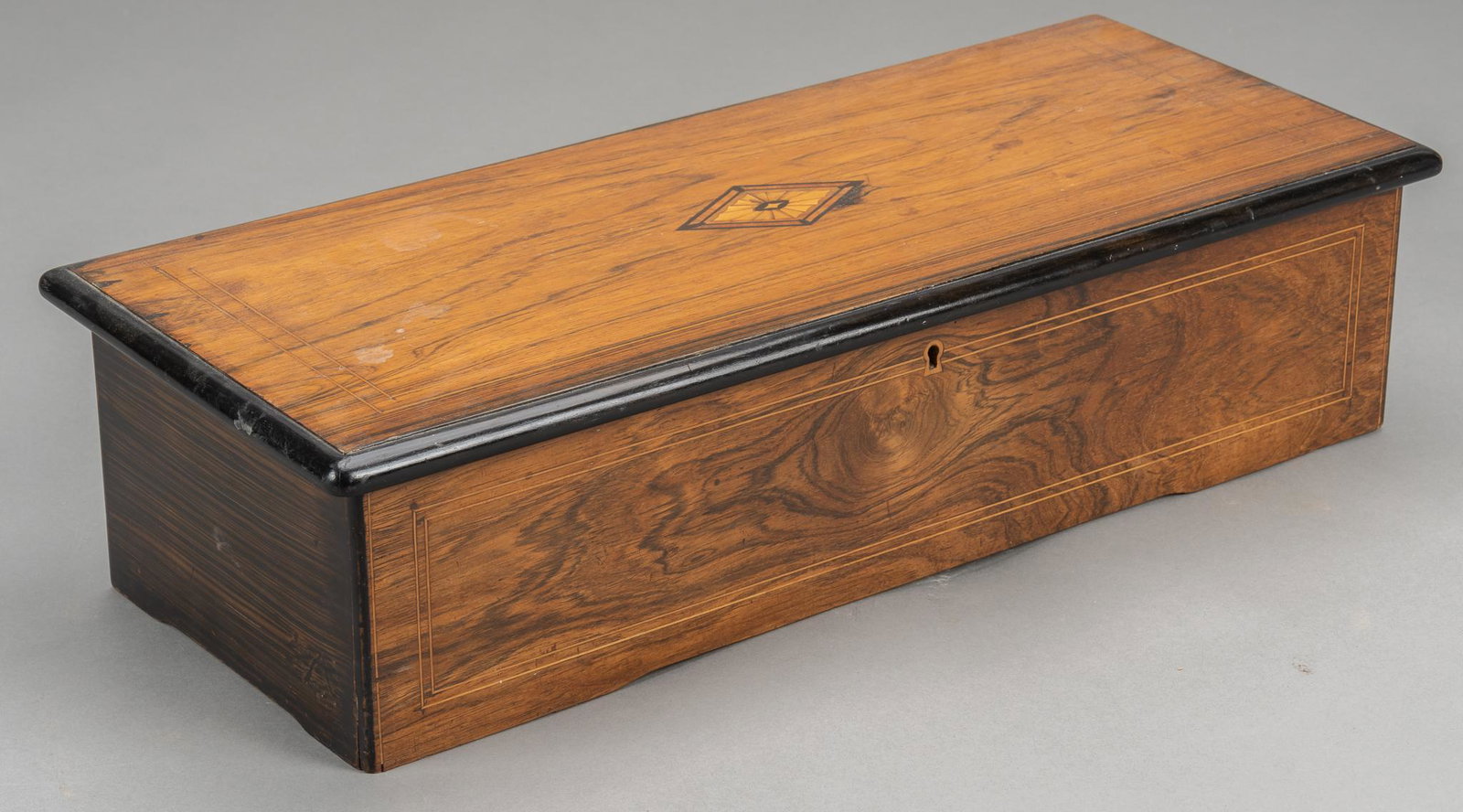 Musical Cylinder Box by George Baker & Co.: Musical cylinder box, manufactured by George Baker & Company (Switzerland), circa 1880-1890, playing eight classical tunes including, two combs of fifty teeth each height 6 in. x width 23 in. x de