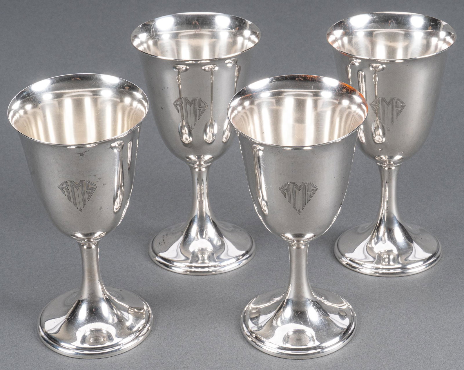Frank Smith Sterling Silver Water Goblets: Four (4) vintage sterling silver water wine glasses no 186 by Frank W. Smith Silver Co.; monogrammed "RMS". Height 6 1/4 in.; total weight 19.21 ozt. Provenance: A Bulverde, Texas collection