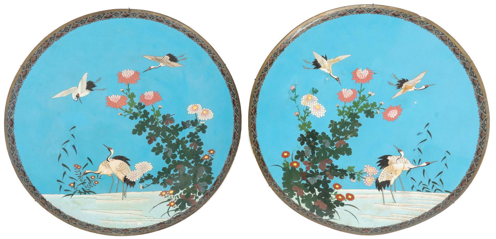 Pair of Japanese Meiji Period CloisonnÃƒÂ© Chargers: Pair of Japanese cloisonne chargers, Meiji period (1869-1912), in the style of Hayashi Kodenji, depicting cranes among flowers and water, against blue background, underside decorated with wave-like sw